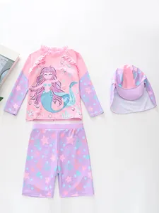 Close-up of girls' mermaid swimsuit set with ruffle trim and long sleeve sun protection