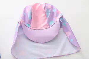 Detail of kids mermaid pattern swimming hat with sun protection neck flap and brim