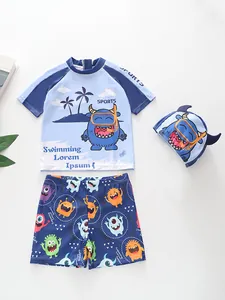 Dreiteiliges Jungen-Badeset mit blauem Monstermuster, inkl. Kurzarmshirt und Badekappe