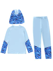 Detailed flat lay of children's long-sleeve rash guard set with blue whale pattern