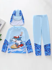 Detailed flat lay of boys blue shark print long sleeve swimsuit with matching hat and pants