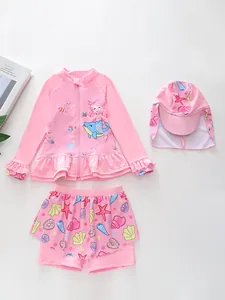 Detailed view of girls mermaid three-piece swimsuit with long sleeve top and ruffle skirt