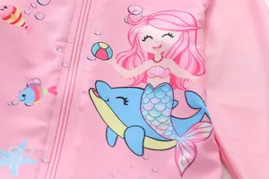 Detail of pink girls swimsuit with mermaid print and smooth zipper closure