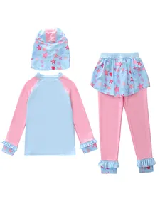 Detailed view of 3-piece girls' swimwear with long sleeves, pants and starfish patterns