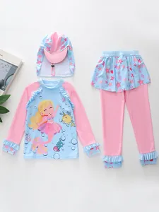 Detailed flat lay of a girls' 3-piece swimsuit with mermaid prints and matching sun hat