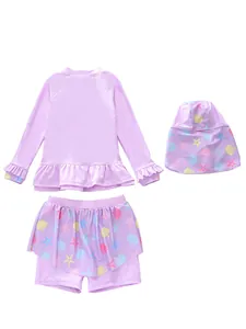 Close-up of lilac three-piece girls' swimwear set with ruffles and seashell print