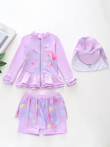 Detailed flat lay of purple three-piece mermaid swimsuit with zipper top and sun hat