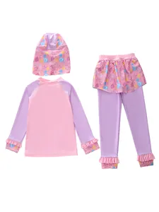 Detailed view of girls' long sleeve swimwear set with ocean motifs and ruffle trims