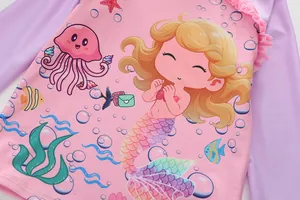Detail of pink long sleeve girls swimsuit with mermaid print and ruffled collar