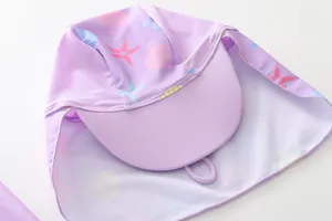 Detail of purple sun hat with sea life print and neck protection for kids