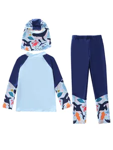 Three-piece long sleeve boys swimwear set with blue ocean cartoon prints and sun hat
