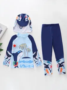 Detailed view of kids 3-piece swimwear set with long sleeves and ocean shark prints