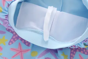 Detail of girls mermaid starfish swimsuit featuring mesh lining and white drawstring