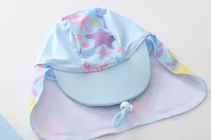 Detail of light blue sun hat with shell prints, neck flap and adjustable toggle