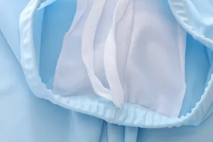 Detail view of boys swim shorts featuring elastic waistband with drawstring and mesh lining