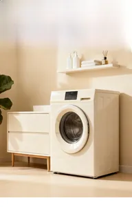 Modern cream-colored front-load washing machine with LED touch panel and minimalist cabinet