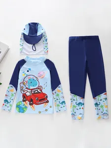 Three-piece boys long sleeve swimsuit with dinosaur astronaut print and matching hat