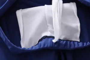 Detail view of boys swimwear featuring mesh lining and white drawstring on elastic waistband