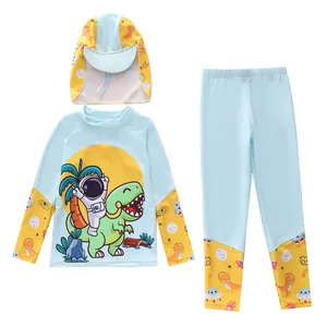 Detail of kids long sleeve swimwear featuring astronaut dinosaur print and blue sun hat