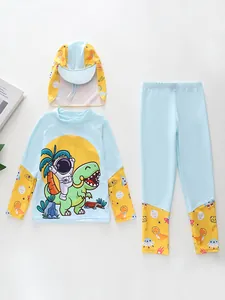 Detailed flat lay of kids blue and yellow dinosaur themed sun protection swimwear set