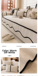 Macro detail of off-white chenille sofa cover showing corduroy texture and wavy border