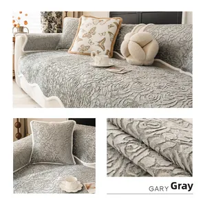 Detail of grey rose velvet sofa cushion with embossed floral texture and cream edging