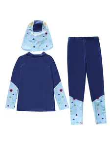 Three-piece long sleeve kids swimwear featuring dinosaur and space patterns in blue