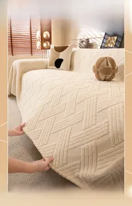 Close-up of thick cream waffle textured sofa cover fabric showing premium material density