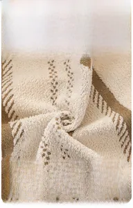 Macro detail of houndstooth jacquard fabric with thick plush texture and hooked yarn finish