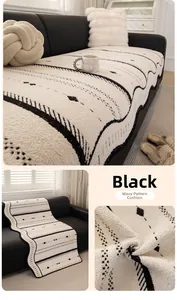 Close-up of textured white non-slip sofa cover with black wavy patterns and soft loops