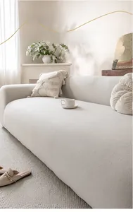 Detail shot of cream thickened polar fleece sofa cover with soft textured fabric