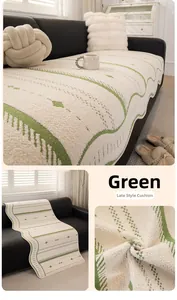 Detail of cream sofa cover with green wave patterns and soft chenille texture