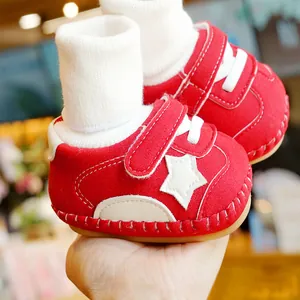 Red baby walking shoes with white star patch and soft soles, includes matching white socks