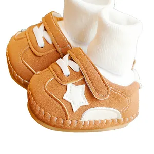 Brown fleece baby walking shoes with soft non-slip soles and velcro straps