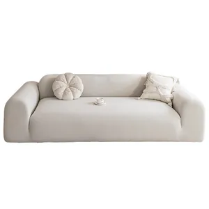 Thick polar fleece stretch sofa cover in light gray with matching decorative pillows