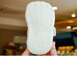 Detail of baby walking shoe sole with anti-slip texture and size 16 marking