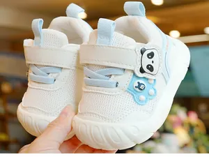 Close-up of baby walking shoes featuring breathable mesh and cute panda cartoon detail