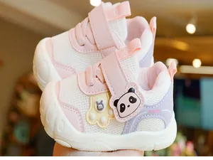 Detail of pink toddler sneaker with mesh fabric and panda cartoon velcro closure
