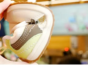 Close-up showing the flexible non-slip soft sole and breathable mesh of baby walking shoes