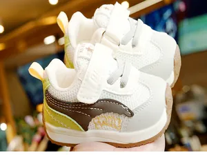 Detail of baby walking shoes featuring breathable mesh and durable rubber soles