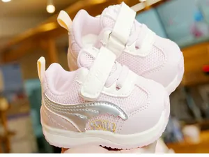 Close-up of pink toddler sneakers with breathable mesh, magic tape, and smile embroidery