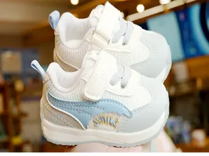 Close-up of toddler walking shoe with breathable mesh and SMILE embroidery detail