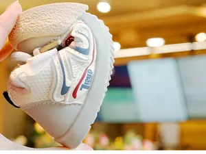 Detailed view of flexible toddler walking shoe with non-slip sole and mesh panels