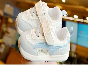 Detail view of toddler shoes featuring breathable mesh fabric and a secure velcro strap