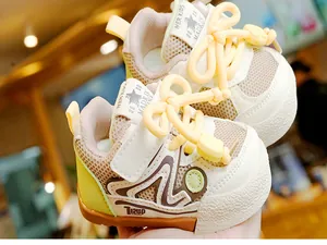 Detailed macro of breathable mesh and anti-collision toe on toddlers' walking shoes