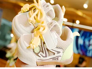 Detail of toddler shoe with mesh fabric, cute bear motif, and non-slip rubber sole