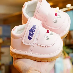 Pink toddler walking shoes with tulip embroidery and non-slip rubber soles for babies