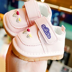 Pink floral embroidered baby walking shoes with soft non-slip soles and velcro straps