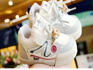 Close-up of baby walking shoes with breathable mesh and wood letter beads detail