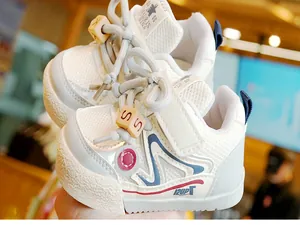 Close-up of breathable mesh toddler shoes with anti-collision toe and velcro closure